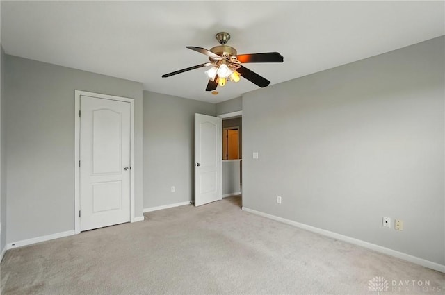 9235 Great Lakes Cir, Washington Twp, OH 45458 - unfurnished bedroom with baseboards, light colored carpet, and a ceiling fan