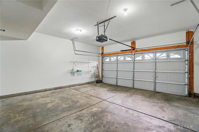 9235 Great Lakes Cir, Washington Twp, OH 45458 - garage with a garage door opener and baseboards