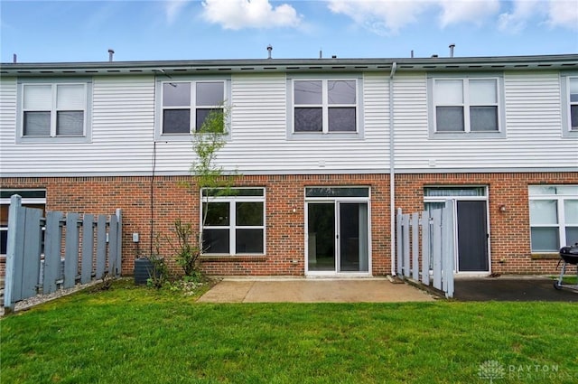 9235 Great Lakes Cir, Washington Twp, OH 45458 - back of house featuring brick siding and a patio area