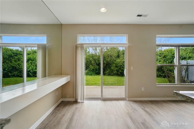 9235 Great Lakes Cir, Washington Twp, OH 45458 - doorway with baseboards, wood finished floors, healthy amount of natural light, and recessed lighting