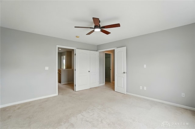 9235 Great Lakes Cir, Washington Twp, OH 45458 - unfurnished bedroom featuring light carpet, baseboards, and a ceiling fan