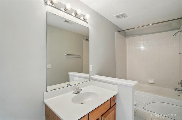 9235 Great Lakes Cir, Washington Twp, OH 45458 - bathroom featuring toilet, tub / shower combination, and vanity