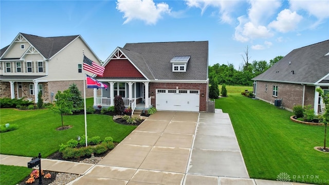 9777 Winding Creek Blvd, Clearcreek Twp, OH 45458 - craftsman inspired home with brick siding, concrete driveway, a front lawn, and covered porch