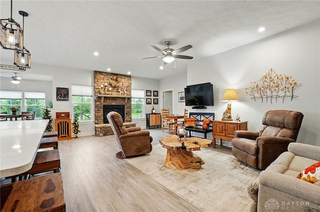 9777 Winding Creek Blvd, Clearcreek Twp, OH 45458 - living area featuring a ceiling fan, wood finished floors, a fireplace, and recessed lighting