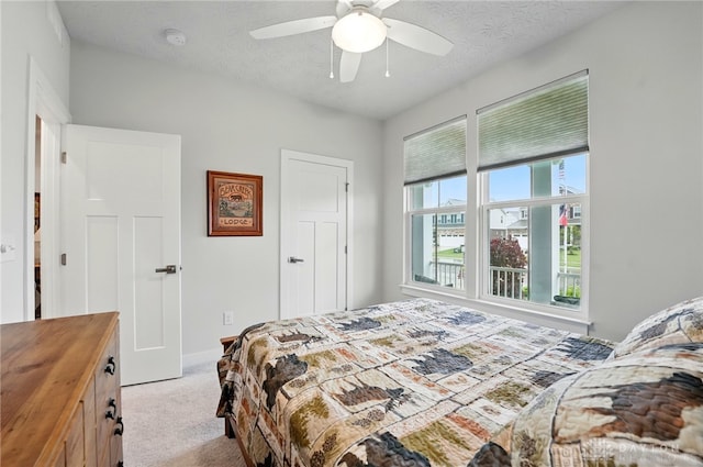 9777 Winding Creek Blvd, Clearcreek Twp, OH 45458 - bedroom featuring carpet floors, a ceiling fan, baseboards, and a textured ceiling