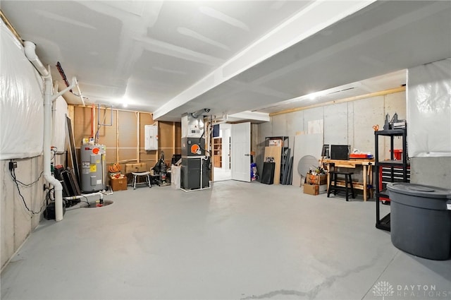 9777 Winding Creek Blvd, Clearcreek Twp, OH 45458 - unfinished basement featuring electric water heater, electric panel, and heating unit