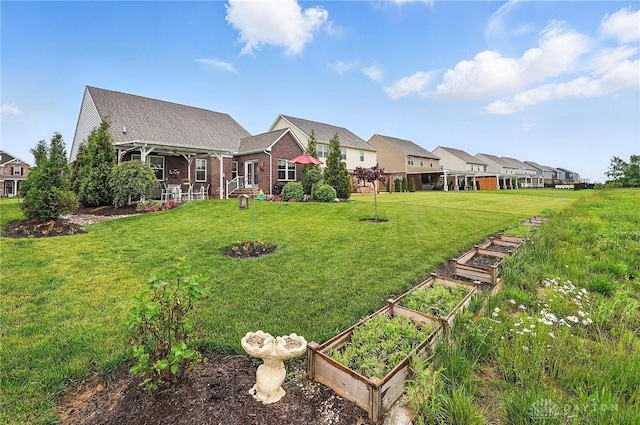9777 Winding Creek Blvd, Clearcreek Twp, OH 45458 - view of grassy yard with a garden