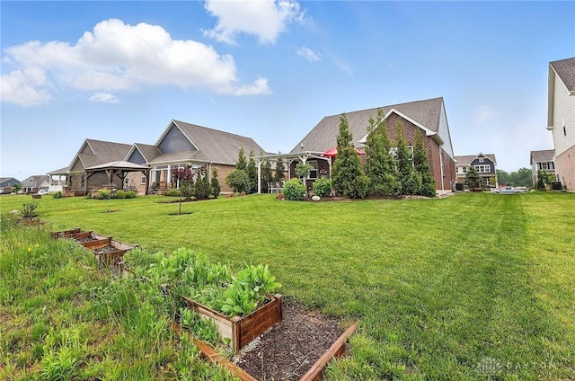 9777 Winding Creek Blvd, Clearcreek Twp, OH 45458 - view of green lawn featuring a gazebo and a vegetable garden