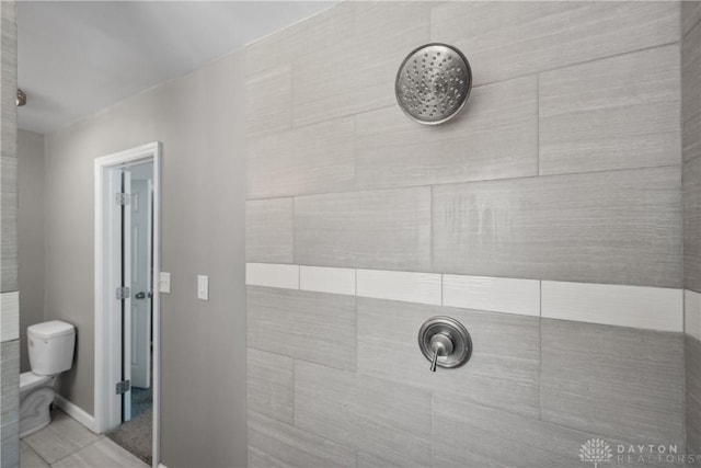 2089 Clearview Dr, Bellbrook, OH 45305 - full bathroom with a tile shower, toilet, and tile patterned floors