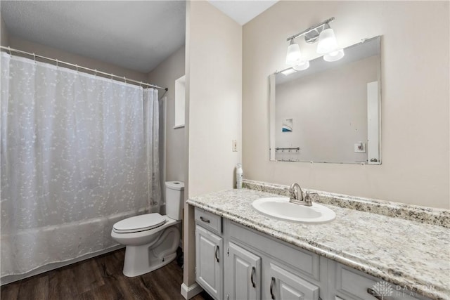 2089 Clearview Dr, Bellbrook, OH 45305 - bathroom with wood finished floors, vanity, toilet, and shower / bathtub combination with curtain