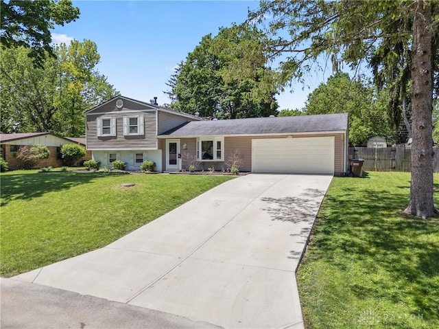 2089 Clearview Dr, Bellbrook, OH 45305 - split level home with an attached garage and concrete driveway