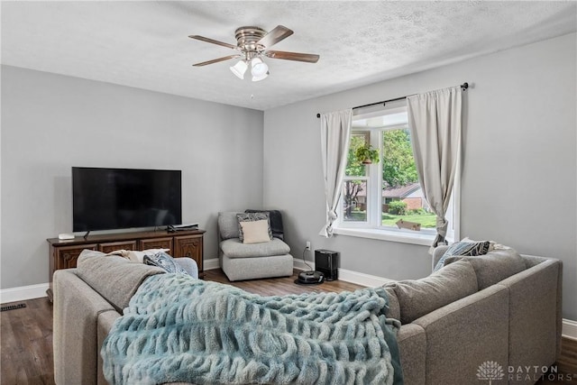 2089 Clearview Dr, Bellbrook, OH 45305 - living area with dark wood finished floors, a ceiling fan, and baseboards