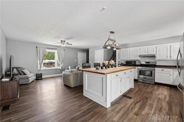 2089 Clearview Dr, Bellbrook, OH 45305 - kitchen featuring stainless steel gas stove, open floor plan, wood counters, and under cabinet range hood
