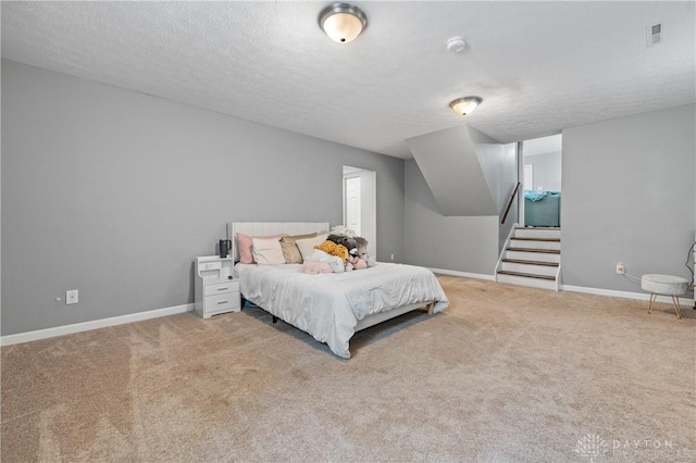 2089 Clearview Dr, Bellbrook, OH 45305 - carpeted bedroom with a textured ceiling and baseboards