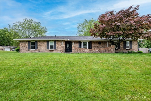 4491 Powder Horn Dr, Beavercreek, OH 45432 - ranch-style house featuring a front yard and brick siding