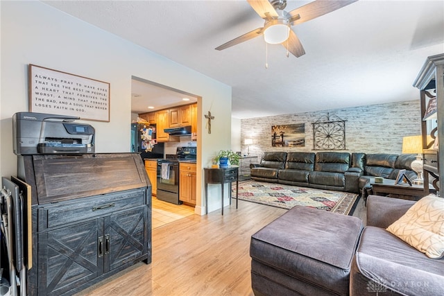 4491 Powder Horn Dr, Beavercreek, OH 45432 - living room featuring ceiling fan, light wood-style flooring, and an accent wall