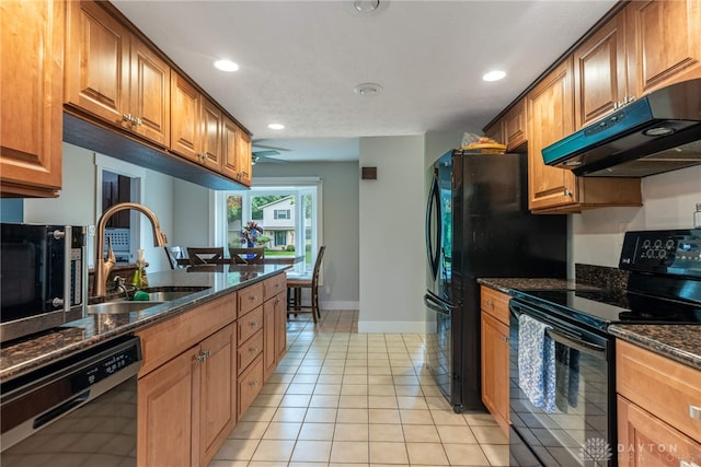 4491 Powder Horn Dr, Beavercreek, OH 45432 - kitchen with black appliances, under cabinet range hood, a sink, recessed lighting, and light tile patterned floors