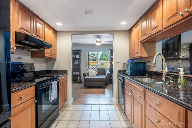4491 Powder Horn Dr, Beavercreek, OH 45432 - kitchen with black appliances, under cabinet range hood, a sink, ceiling fan, and light tile patterned floors