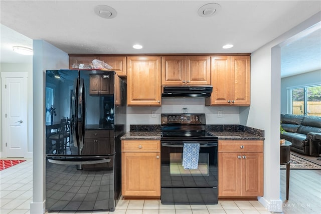 4491 Powder Horn Dr, Beavercreek, OH 45432 - kitchen featuring black appliances, under cabinet range hood, dark stone counters, recessed lighting, and brown cabinetry