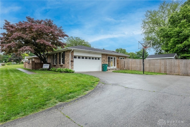 4491 Powder Horn Dr, Beavercreek, OH 45432 - ranch-style house featuring driveway, an attached garage, and brick siding