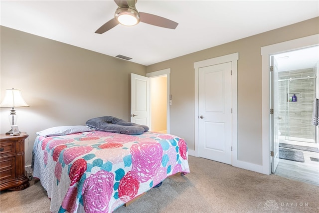 4491 Powder Horn Dr, Beavercreek, OH 45432 - carpeted bedroom with ensuite bathroom, baseboards, and a ceiling fan