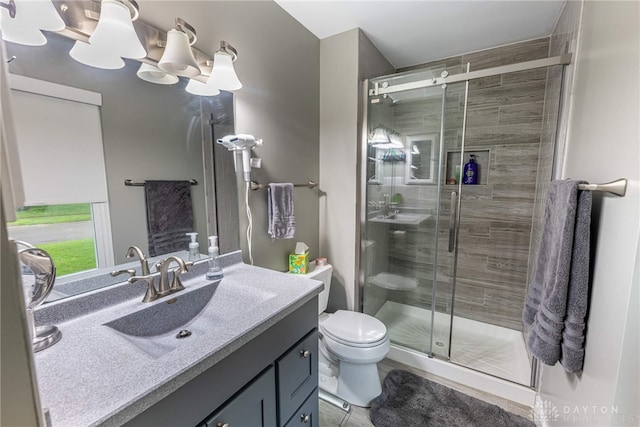 4491 Powder Horn Dr, Beavercreek, OH 45432 - full bathroom with vanity, toilet, and a stall shower