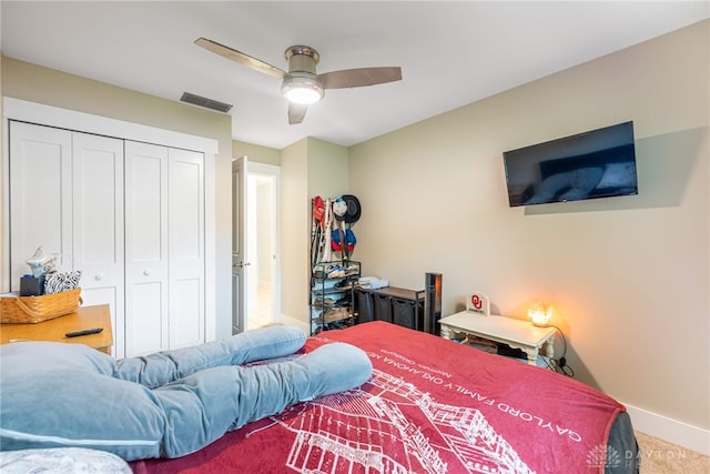 4491 Powder Horn Dr, Beavercreek, OH 45432 - carpeted bedroom featuring a closet, baseboards, and ceiling fan