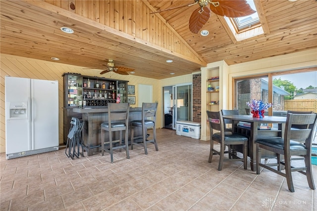 4491 Powder Horn Dr, Beavercreek, OH 45432 - kitchen with white refrigerator with ice dispenser, ceiling fan, open shelves, wooden ceiling, and vaulted ceiling