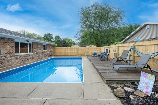4491 Powder Horn Dr, Beavercreek, OH 45432 - view of swimming pool with a wooden deck and a fenced backyard
