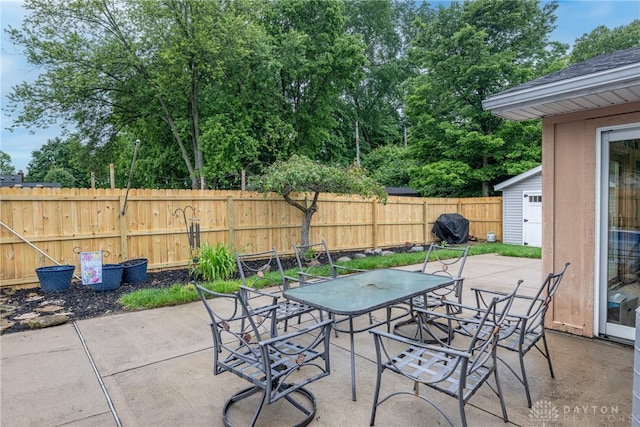 4491 Powder Horn Dr, Beavercreek, OH 45432 - fenced backyard with a patio area and outdoor dining space