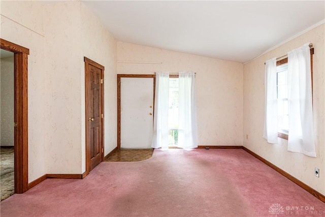 903 Kennison Ave, New Carlisle, OH 45344 - carpeted empty room with lofted ceiling