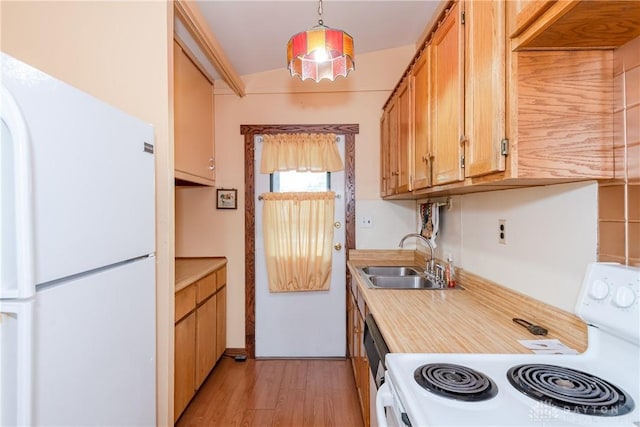 903 Kennison Ave, New Carlisle, OH 45344 - kitchen with freestanding refrigerator, electric range, a sink, light wood finished floors, and light countertops
