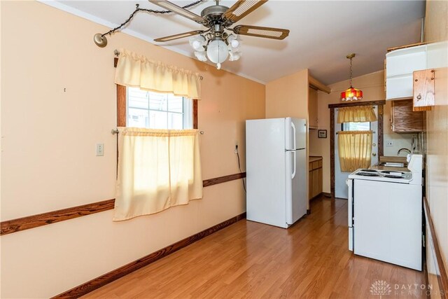 903 Kennison Ave, New Carlisle, OH 45344 - kitchen featuring white appliances, vaulted ceiling, light wood-style flooring, ceiling fan, and baseboards