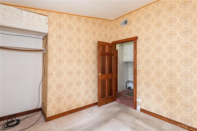 903 Kennison Ave, New Carlisle, OH 45344 - unfurnished bedroom featuring carpet flooring, baseboards, and wallpapered walls