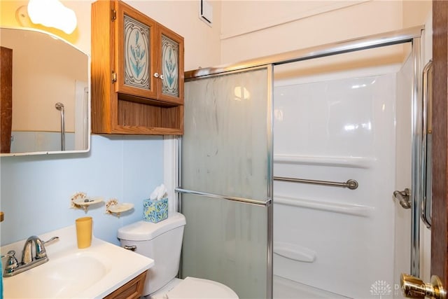 903 Kennison Ave, New Carlisle, OH 45344 - bathroom featuring toilet, a shower with door, and vanity