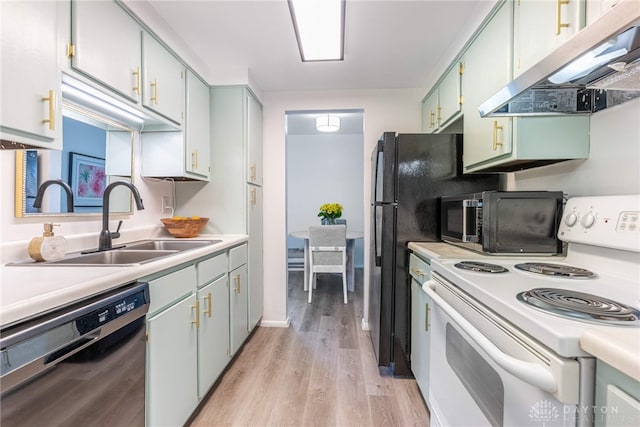 1743 Running Brook Trl Unit C, West Carrollton, OH 45449 - kitchen with white range with electric stovetop, dishwasher, under cabinet range hood, a sink, and light wood-type flooring