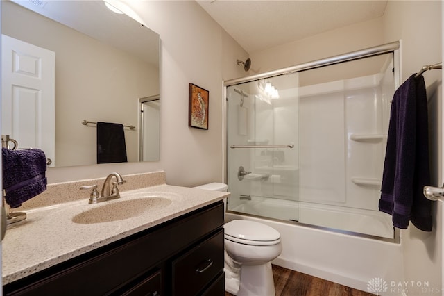 148 Oasis Ct, Springboro, OH 45066 - full bathroom featuring vanity, toilet, wood finished floors, and enclosed tub / shower combo
