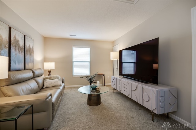 148 Oasis Ct, Springboro, OH 45066 - carpeted living area featuring baseboards