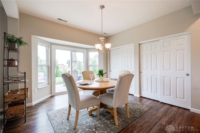 148 Oasis Ct, Springboro, OH 45066 - dining space featuring dark wood finished floors, a chandelier, and baseboards