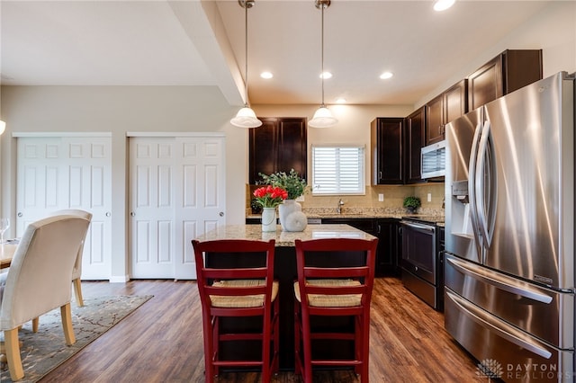 148 Oasis Ct, Springboro, OH 45066 - kitchen featuring appliances with stainless steel finishes, a sink, a center island, dark wood-type flooring, and recessed lighting