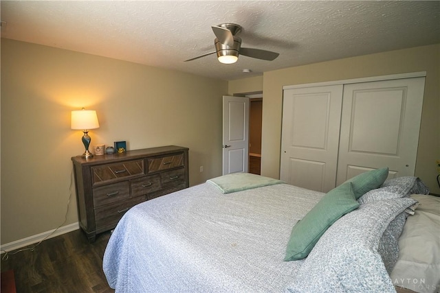 1331 Peregrine Way, Hamilton, OH 45013 - bedroom featuring dark wood-type flooring, a closet, baseboards, ceiling fan, and a textured ceiling