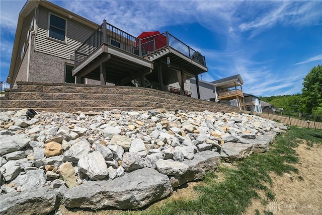 1331 Peregrine Way, Hamilton, OH 45013 - rear view of house featuring a wooden deck and stone siding
