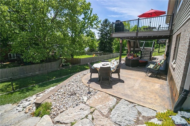 1331 Peregrine Way, Hamilton, OH 45013 - fenced backyard with a patio area, stairway, a wooden deck, and outdoor dining area