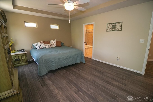 1331 Peregrine Way, Hamilton, OH 45013 - bedroom featuring a tray ceiling, baseboards, and dark wood-style floors