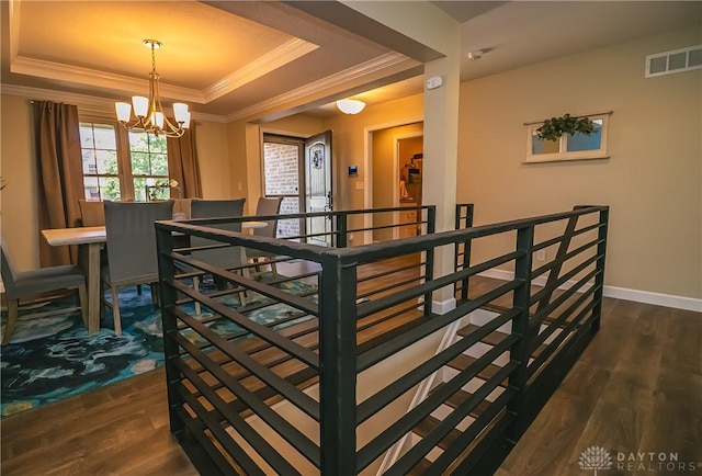1331 Peregrine Way, Hamilton, OH 45013 - stairs with a raised ceiling, wood finished floors, a chandelier, crown molding, and baseboards