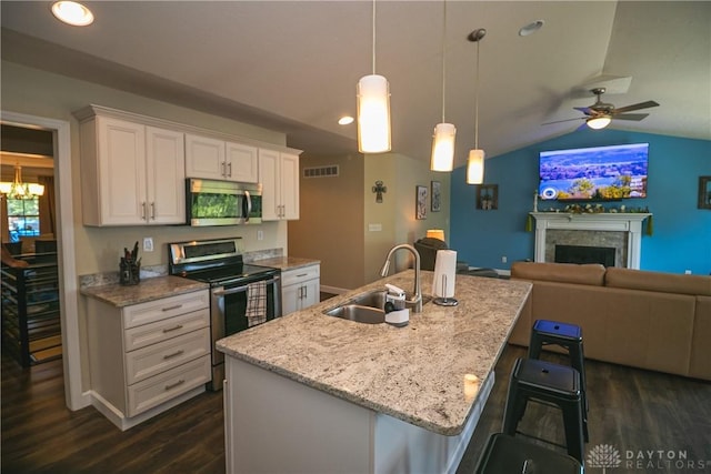 1331 Peregrine Way, Hamilton, OH 45013 - kitchen featuring appliances with stainless steel finishes, a sink, open floor plan, dark wood-type flooring, and white cabinetry