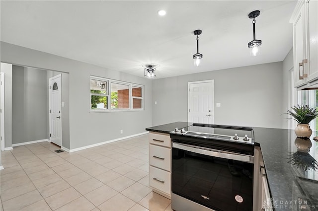 3040 Fontano Dr, Kettering, OH 45440 - kitchen with stainless steel electric range, white cabinets, decorative light fixtures, baseboards, and light tile patterned flooring