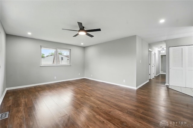 3040 Fontano Dr, Kettering, OH 45440 - spare room featuring ceiling fan, dark wood finished floors, baseboards, recessed lighting, and a chandelier