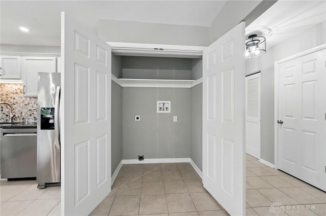3040 Fontano Dr, Kettering, OH 45440 - washroom featuring washer hookup, hookup for an electric dryer, light tile patterned floors, recessed lighting, and baseboards