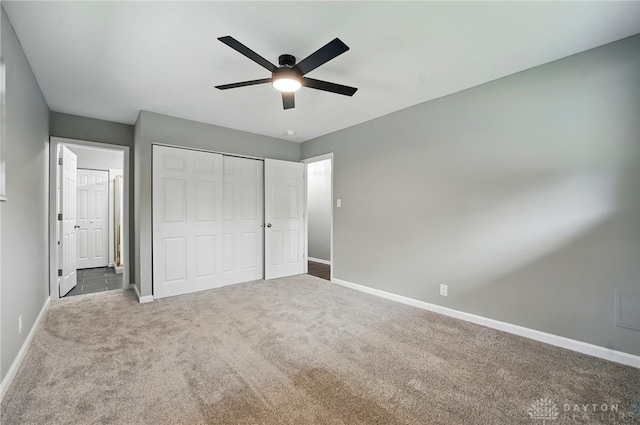 3040 Fontano Dr, Kettering, OH 45440 - unfurnished bedroom featuring baseboards, carpet floors, a closet, and a ceiling fan